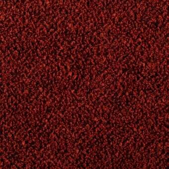 Rust-red looped pile fabric texture with granular appearance, varying loop heights, and tonal shifts; Bonaldo Rella SP02 textile sample.